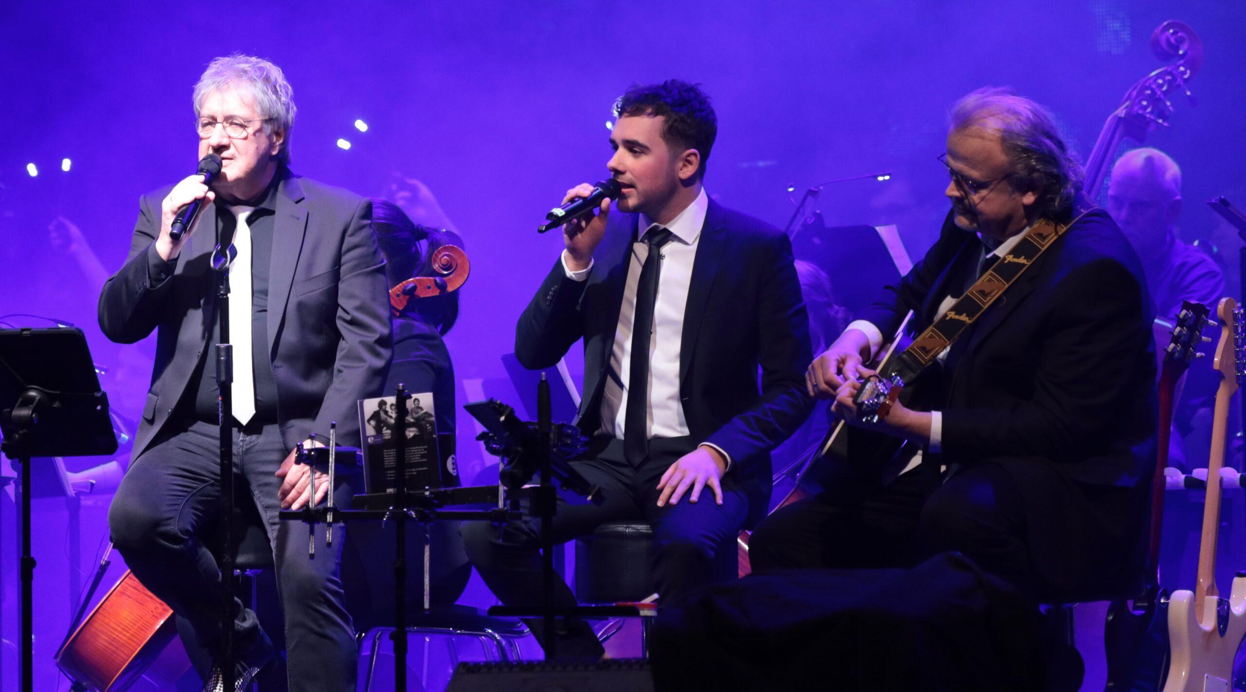 Three members of FUN on stage